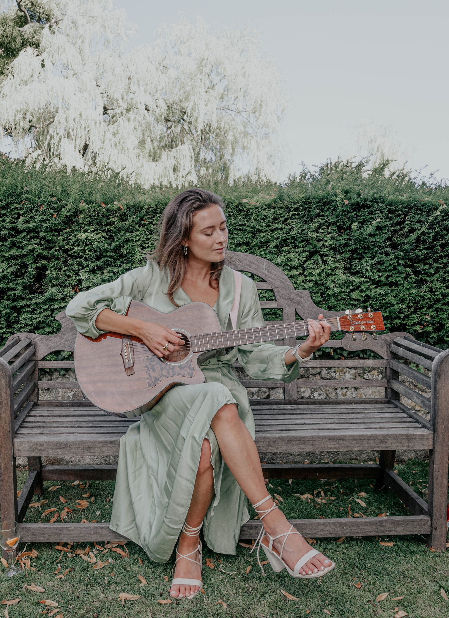 Abigail Cardwell performing solo with acoustic guitar